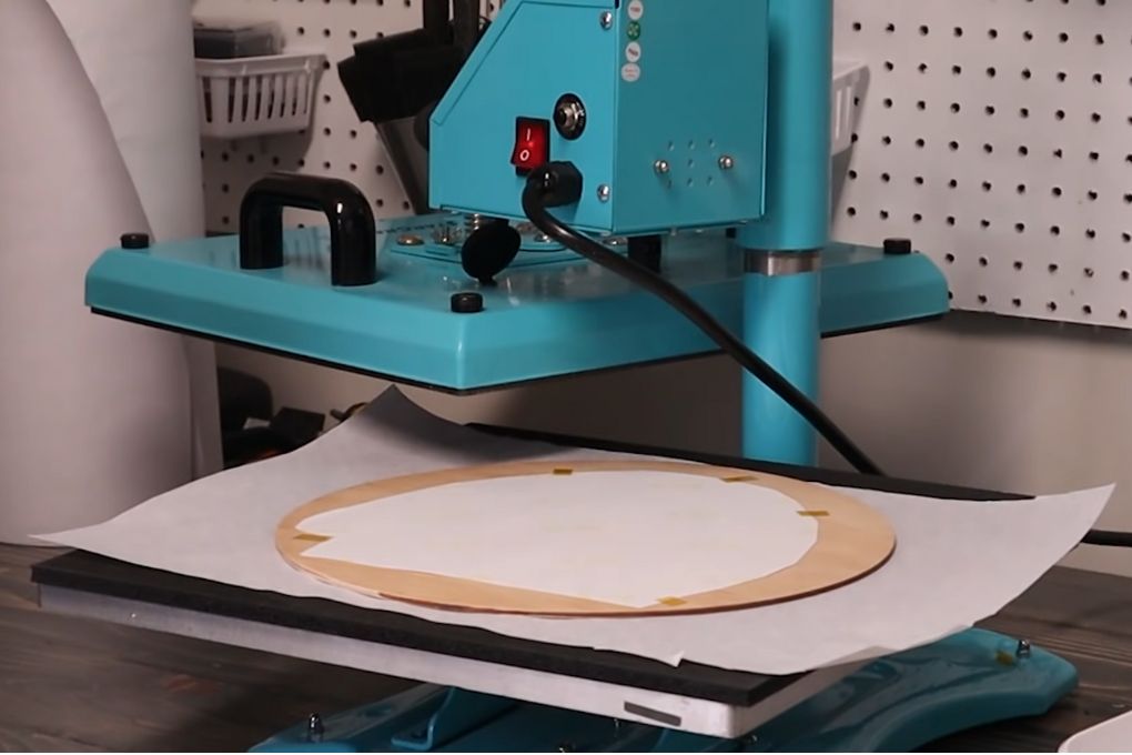 Placing wooden pieces into the heat press