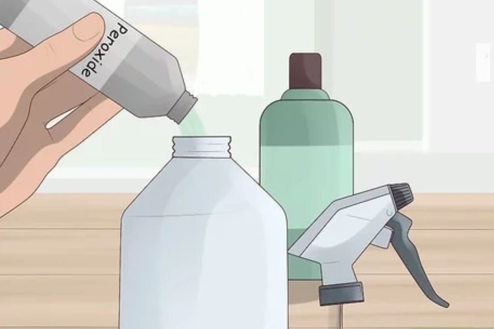 Pouring bleach into a spray bottle