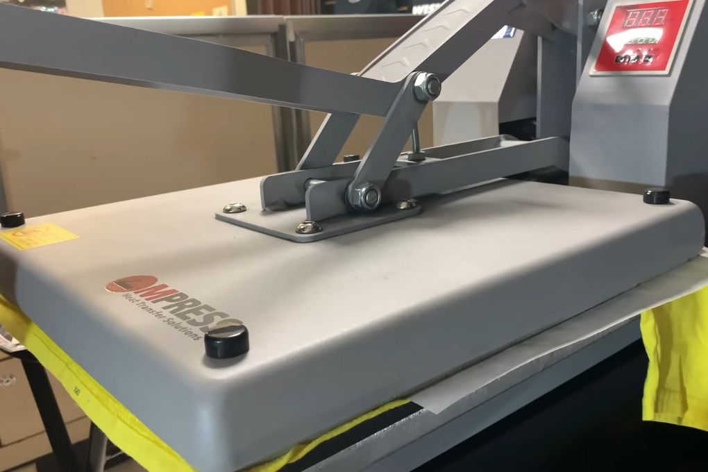 Turning on the Heat press and pressing the material